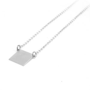 SQUARE SILVER PENDANT. PLATONIC. MINIMAL COLLECTION. CONTEMPORARY JEWELRY. MINIMALIST JEWELRY. AUTHOR JEWELRY. MADE IN GRANADA. MADE IN ANDALUSIA. MADE IN SPAIN. CRAFTS. HAND-MADE JEWELRY