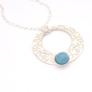 Blue Nasrid Palaces detail pendant inspired by the mural decoration of the Alhambra, Granada. Signature jewelery based on the ataurique plasterwork of Andalusian architecture. Contemporary sterling silver and glass jewelry. Ethnic and sophisticated style. Made in Spain. Local crafts.