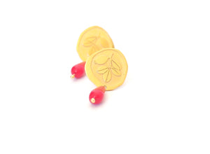 Gold plated sterling silver and reconstituted coral stud earrings. Current and modern flamenco earrings. Contemporary signature jewelry inspired by traditional flamenco fashion. Granada crafts. Jewels made from Andalusia. Earrings inspired by the botany of the Alhambra and Granada.